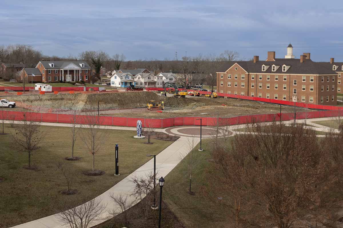 excavation for the data science building near the corner of high street and tallawanda with a red fence surrounding