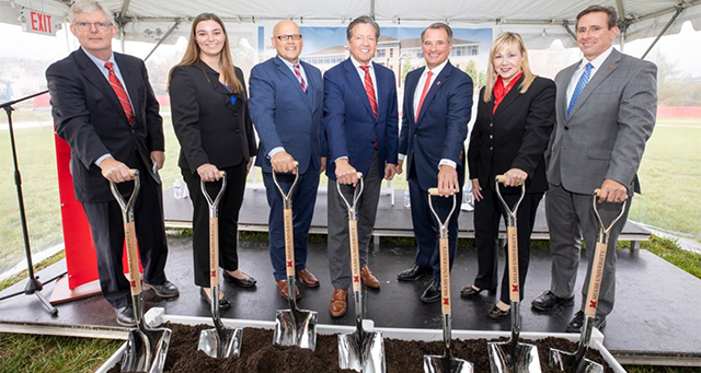 richard mcvey and other vips pose with shovels 