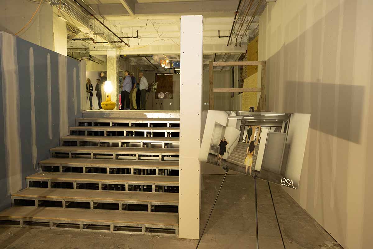 College at Elm building interior stairwell under renovation