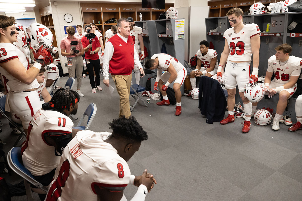 Miami coach Chuck Martin talks to the team