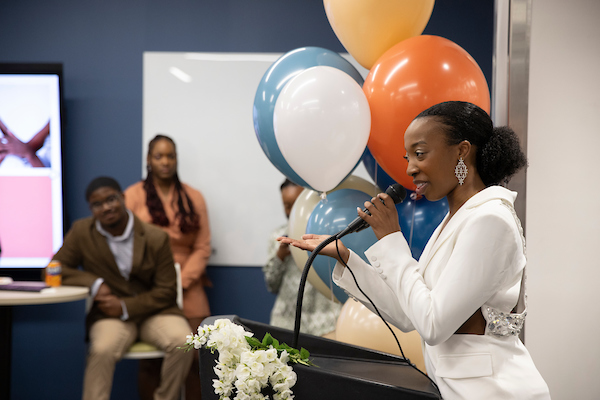 VaLanDria Smith-Lash speaks at the ribbon cutting for her business, Coarse Culture.