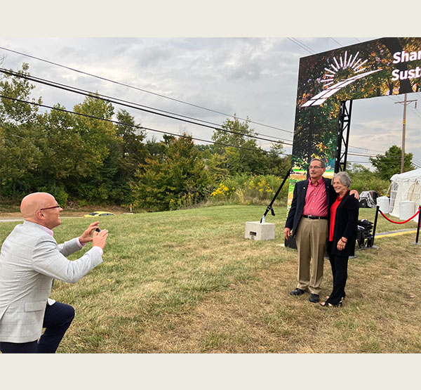 Greg Crawford takes a photo of Sharon and Graham Mitchell
