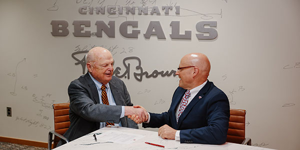 Mike Brown, owner of the Cincinnati Bengals, left, and Miami University President Gregory Crawford