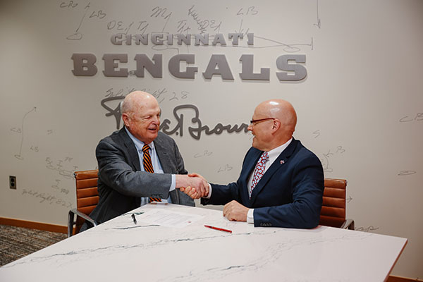 Mike Brown, owner of the Cincinnati Bengals, left, and Miami University President Gregory Crawford