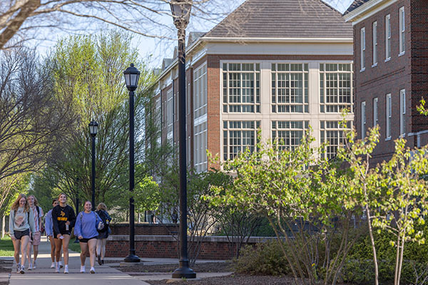 Students walk by the psychology building