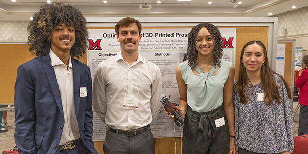 Miami University students Dru Frazier, Tim Archibald, Ruby Davis, and Eva Goorskey with their project at the Undergraduate Research Forum.
