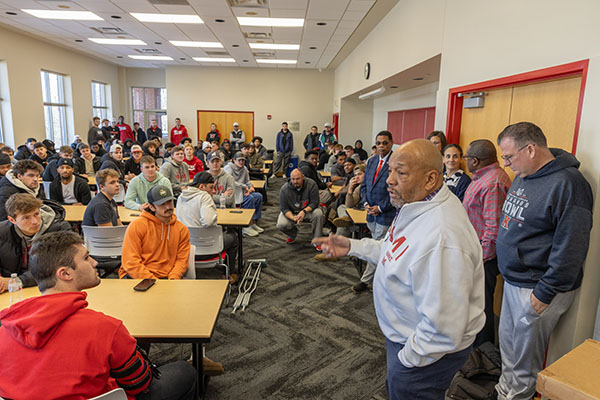 Rodney Coates talks with the Miami University football team