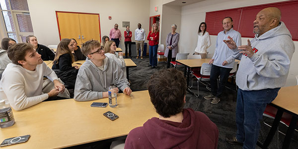 Rodney Coates talks with Miami University men's and women's basketball teams
