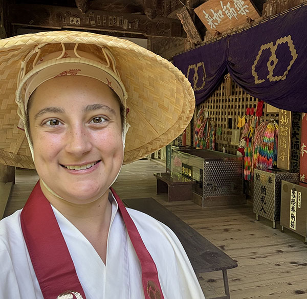 Caitlin Buzzard in traditional Shikoku Pilgrimage garments and hat