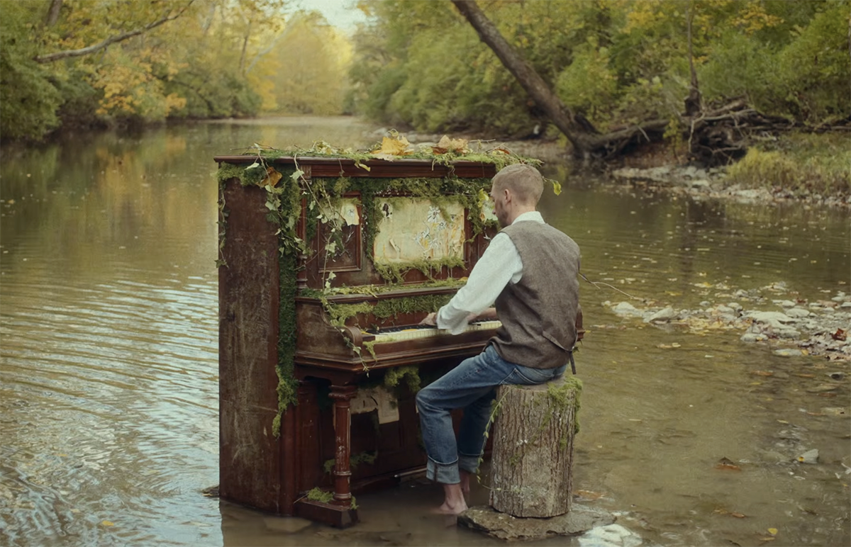jon sanford plays a moss-covered old piano in Four mile Creek 